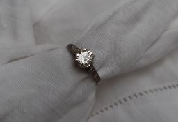 A solitaire diamond ring, the round brilliant cut diamond approximately 0.