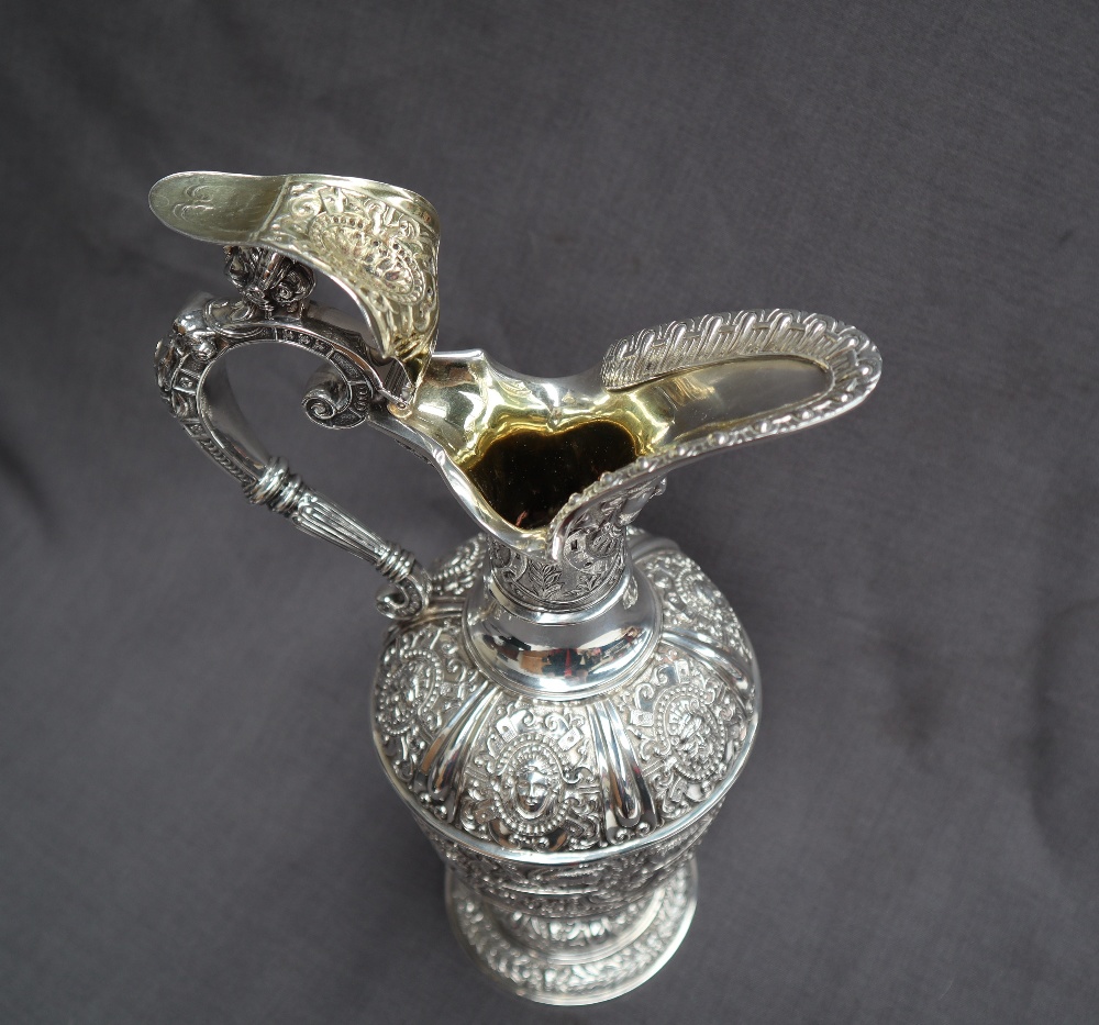 A Victorian silver claret jug, after Cellini, all over decoration of masks and rams, - Image 13 of 13