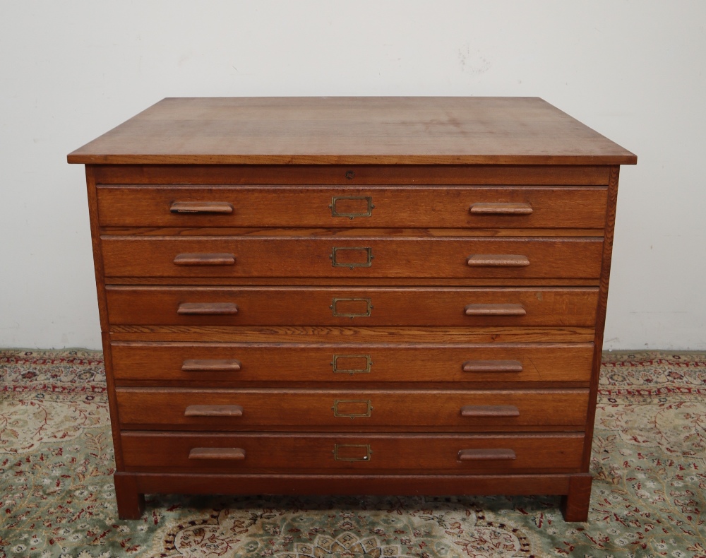 A 20th century oak plan chest, the rectangular top above six drawers on square legs,