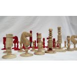 A 19th century bone chess set, barleycorn pattern, one side natural the other stained red, King 8.