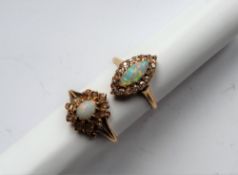 A diamond and opal dress ring of navette shape,