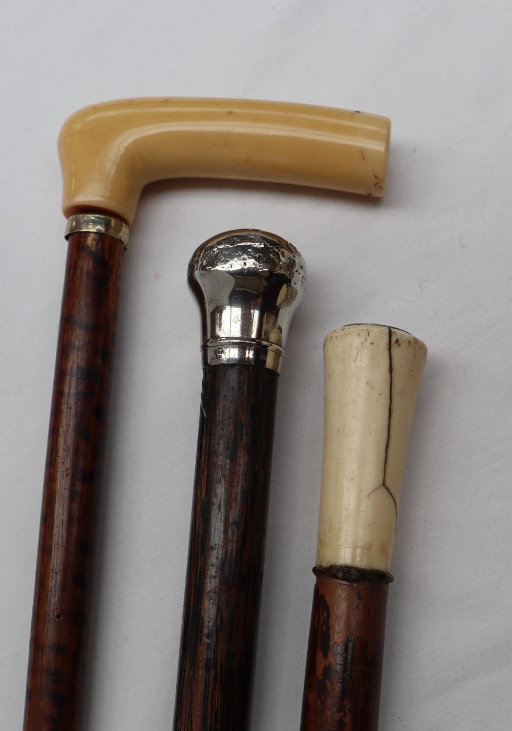 A silver topped walking stick,