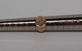 A 9ct yellow gold diamond set signet ring, set with round brilliant cut diamonds,