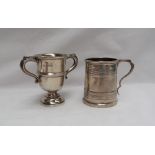 A George V silver twin handled trophy cup, Sheffield, 1930 together with a silver christening mug,