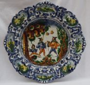 An Italian Maiolica istoriato type charger, of shaped circular form,