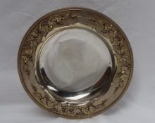 A George V silver gilt comport, the edge cast with grapes,