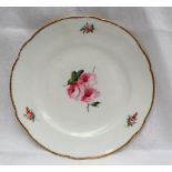 A Nantgarw porcelain plate, with a shaped gilt rim,