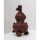 A Yixing pottery double gourd vase decorated with monkeys,