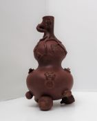 A Yixing pottery double gourd vase decorated with monkeys,