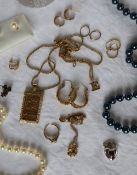 A 9ct gold ingot and chain, together with other 9ct gold chains, 9ct gold earrings,