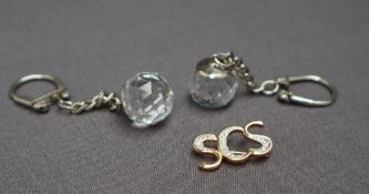 Swarovski crystal -- two keyrings and an SCS badge