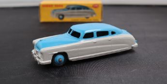 A Dinky Toys diecast model of a Hudson Commodore Sedan, with a two tone highline body,