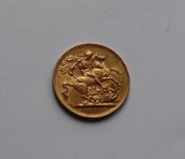 A George V gold sovereign,