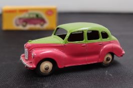A Dinky Toys diecast model of an Austin Devon Saloon, with a two tone highline body,