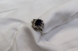 A sapphire and diamond cluster ring,