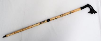 A Japanese bone sectional walking stick, with an ebony dragon carved handle,