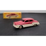 A Dinky Toys diecast model of a Studebaker Land Cruiser,