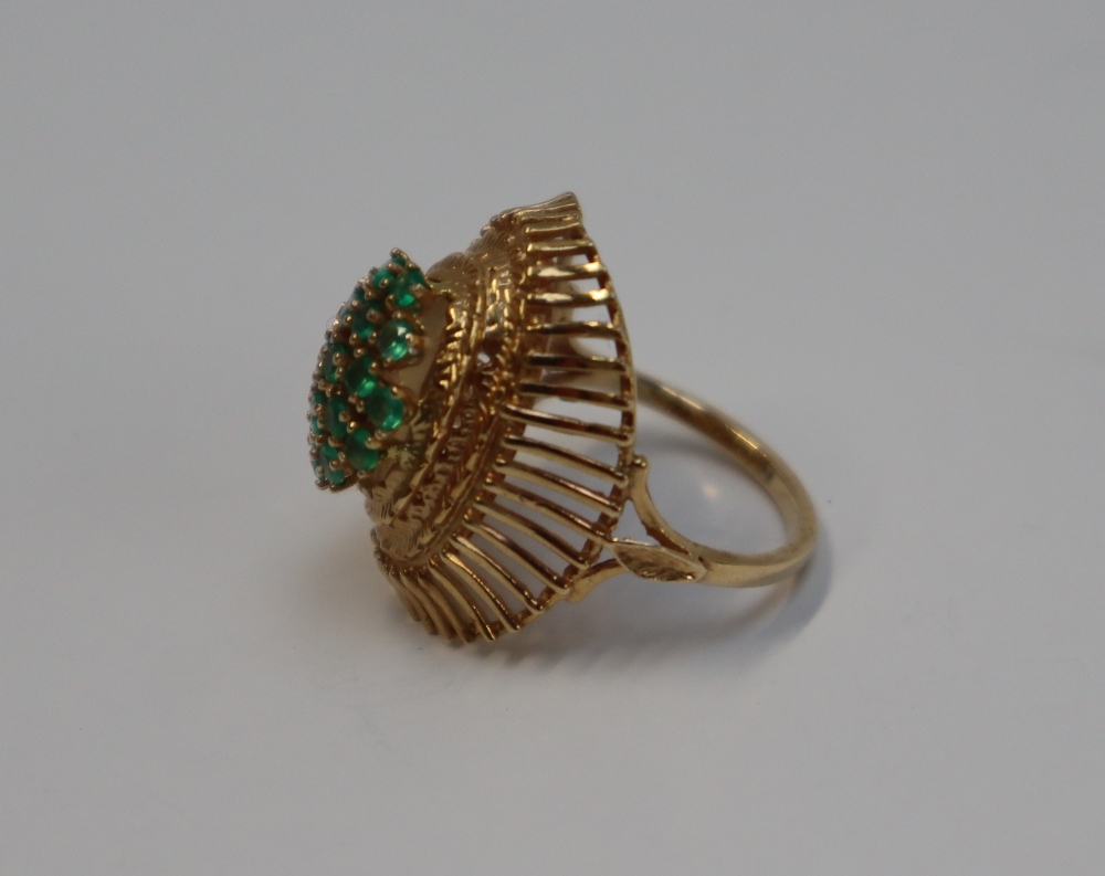 A 14ct yellow gold dress ring, set with a cluster of light green stones, possibly peridot, - Image 4 of 6