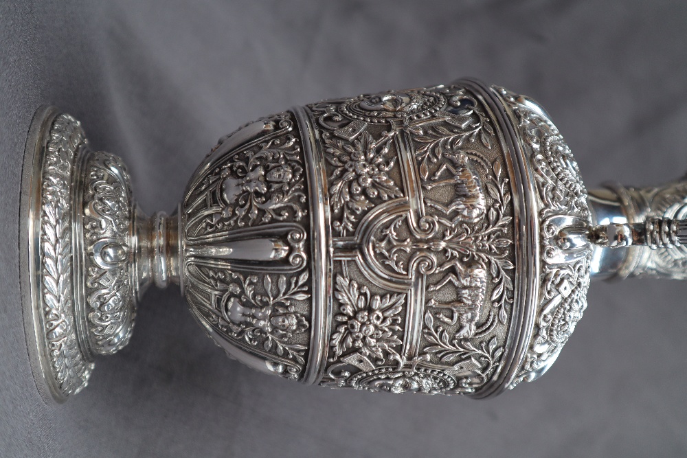 A Victorian silver claret jug, after Cellini, all over decoration of masks and rams, - Image 8 of 13