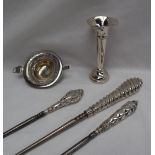 Three silver handled button hooks,