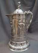 A large Victorian silver lidded jug, the domed top with gladiator head terminal,