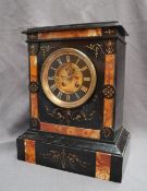 A late Victorian black slate mantle clock,