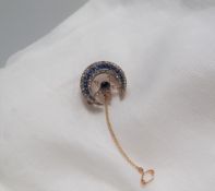 A sapphire and diamond crescent and star brooch, the centre of the star set with a round sapphire,