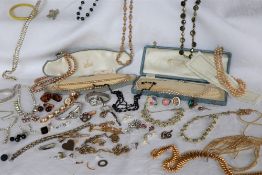 Assorted costume jewellery including earrings, necklaces, cufflinks, bar brooches, faux pearls,