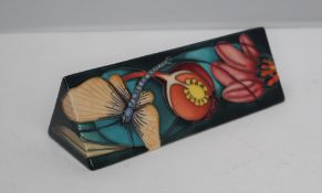 A Moorcroft pottery name plaque, of triangular form, decorated in the Mayfly pattern, dated 2004,