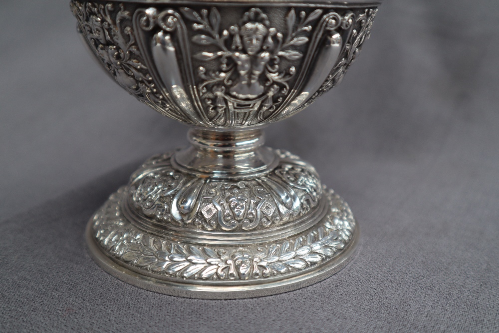 A Victorian silver claret jug, after Cellini, all over decoration of masks and rams, - Image 9 of 13