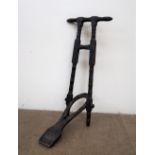 A Victorian ebonised pine boot jack, with a turned handle and uprights,