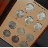 A Morgan Dollar date set from 1878 to 1921, with Mint Marks coins, (missing 1892 and Denver),