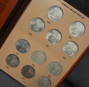 A Morgan Dollar date set from 1878 to 1921, with Mint Marks coins, (missing 1892 and Denver),