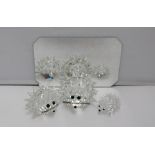 Swarovski crystal -- three hedgehogs of graduating sizes on a mirror