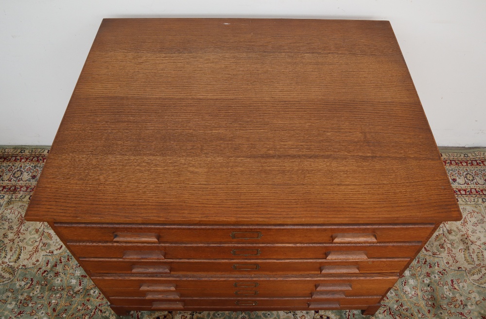 A 20th century oak plan chest, the rectangular top above six drawers on square legs, - Image 7 of 8