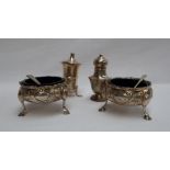 A pair of George III silver cauldron table salts,