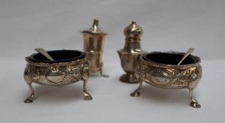 A pair of George III silver cauldron table salts,