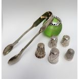 A George V silver topped and green glass table top match strike, together with a silver thimble,