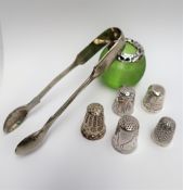 A George V silver topped and green glass table top match strike, together with a silver thimble,