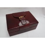 A Rolex burgundy leather watch box, with a buckle top and wooden liner, No.71.00.