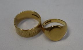 An 18ct yellow gold wedding band, size R together with an 18ct gold signet ring, size M 1/2,