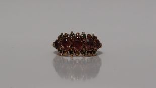 A Victorian yellow metal dress ring set with semi precious stones, size K 1/2, approximately 3.