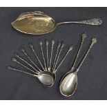 A set of eleven German 800 standard white metal spoons with shield tops and spiral stems together