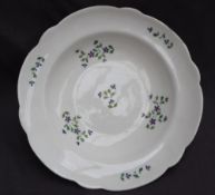 A Nantgarw porcelain bowl, with a shaped edge, decorated with cornflowers,