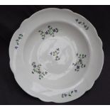 A Nantgarw porcelain bowl, with a shaped edge, decorated with cornflowers,