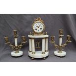 A 19th century French gilt metal and alabaster clock garniture,