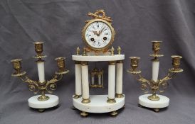 A 19th century French gilt metal and alabaster clock garniture,