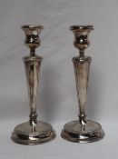 A pair of Elizabeth II silver candlesticks,