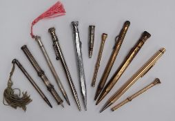 A hallmarked silver propelling pencil together with a gold filled Eversharp propelling pencil,