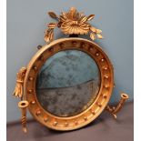 A Victorian gilt gesso girandole of circular form with a shell,